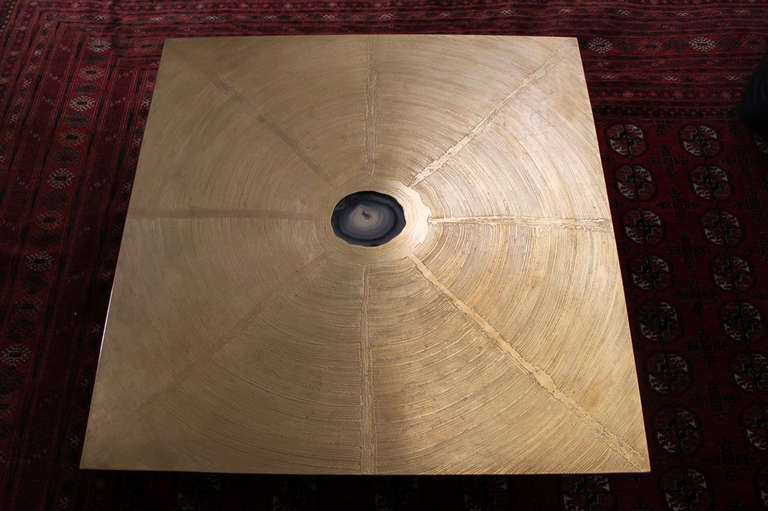 A square bronze coffee table with hand etched abstract star burst design with agate inset , resting on a square black base by George Mathias, Belgium C. 1970's / table is signed by the artist.