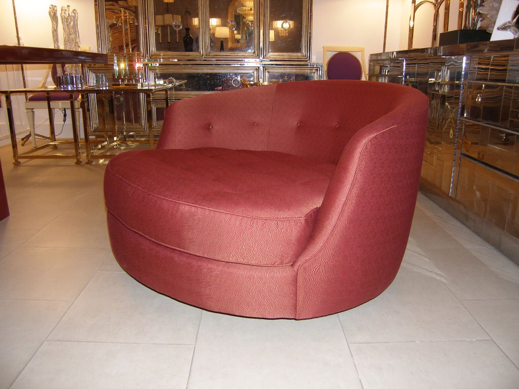 A large tufted swivel lounge chair by Milo Baughman, American C.1970's<br />
Newly upholstered in Pollack / Bodywave 2202/08 Henna<br />
Measurements: Back H 26