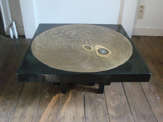 A square cast black resin coffee table top with round etched bronze center with two agate inlays on a multi legged painted steel base by Jean Claude Dresse, Belgium C.1970's <br />
Signed Dresse