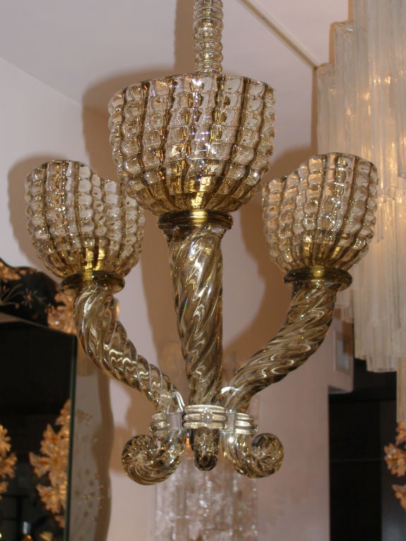 An exquisite three-arm chandelier in smoky topaz with glass neck and canopy by Barovier.

Italian, Circa 1920's

In stock.