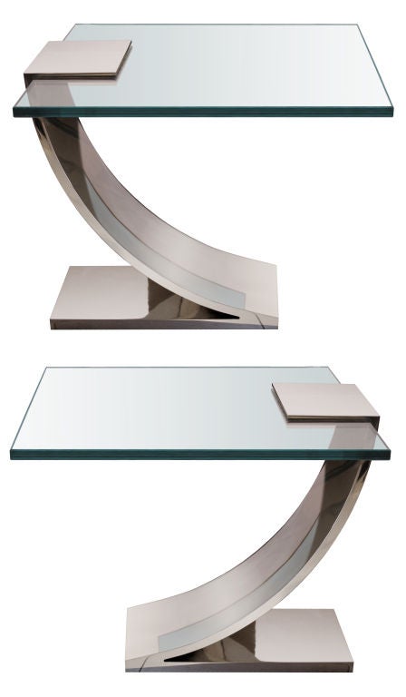 A pair of polished nickel over steel tables with 3/4