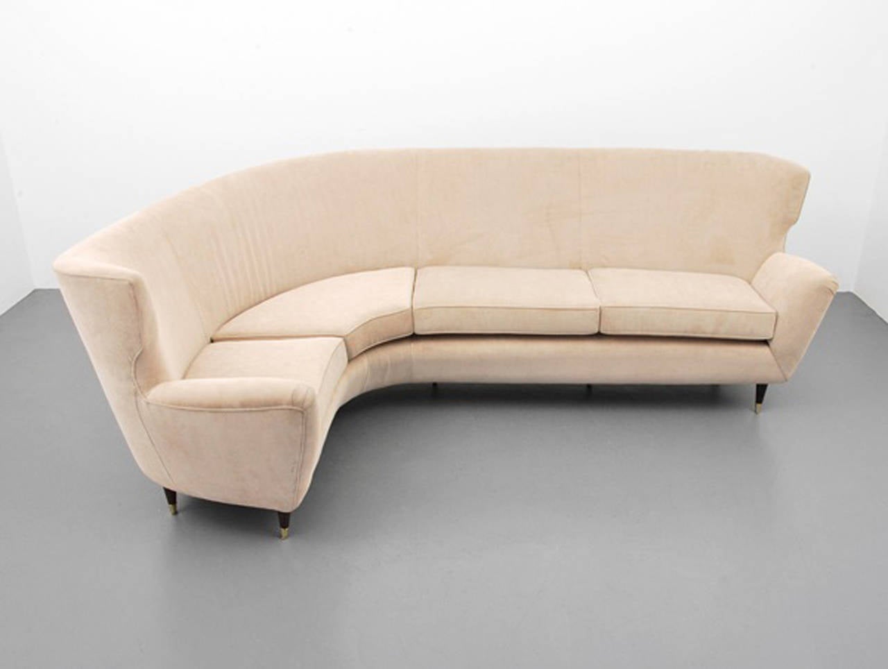 An upholstered sofa with mahogany legs and brass caps attributed to Paolo Buffa, Italian circa 1940's