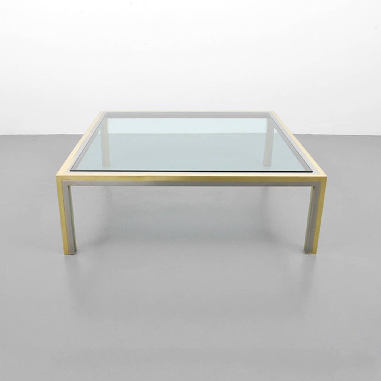 A brass and chrome coffee table with glass inset top by Romeo Rega, Italian, circa 1970s.
