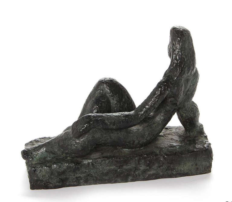 A cast bronze with patina reclining female figure resting on a bronze base by Helge Holmskov. 

(1912-1982) 

Danish, Circa 1963

Model, 1963

In Stock.