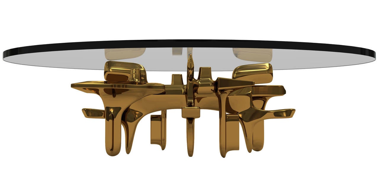 The Roen coffee table with round top by Craig Van Den Brulle.

Available in a high polish bronze or high polish aluminum.
