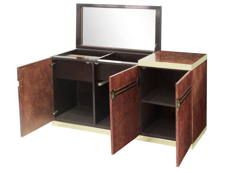 Lift-top bar unit in burled olive wood with brass banding and pulls by Pierre Cardin, American, 1970s (signed 