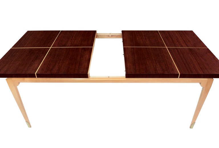 Dining table no.161, with two leaves, in dark mahogany with platinum maple base and inlays and brass sabots by Tommi Parzinger for Parzinger Originals, America, 1950s (branded 