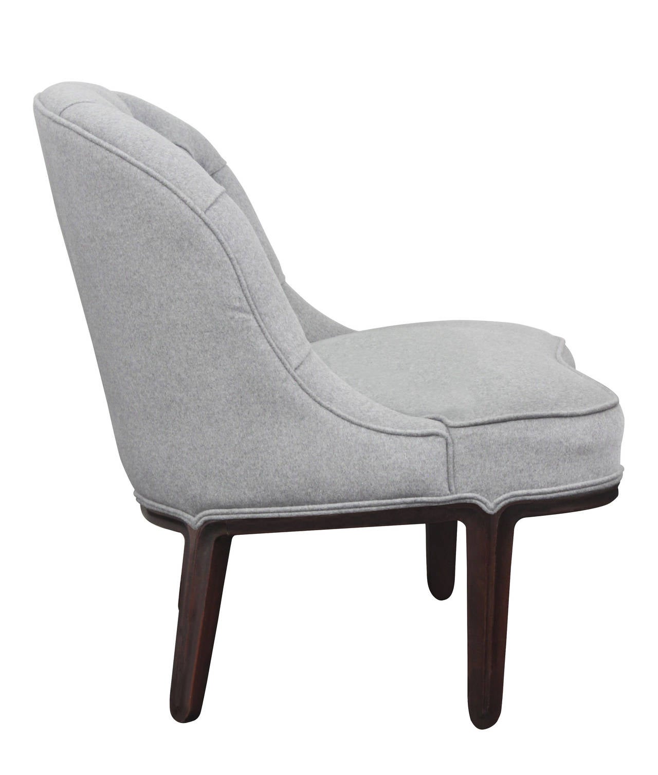 Pair of tufted-back slipper chairs model No. 5775 with sculpted walnut base by Edward Wormley for Dunbar, Janus Collection, American 1957.
Newly upholstered in gray flannel by Lobel Modern.