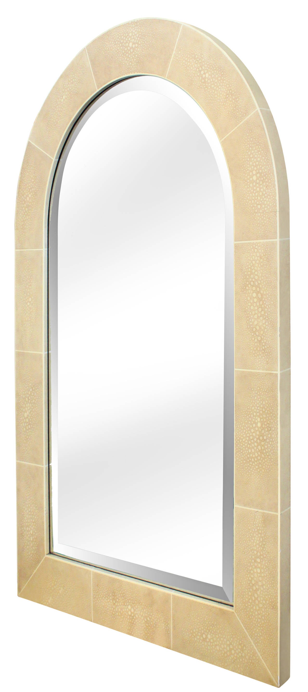 Large wall-hanging arc top mirror with frame in hand-applied beige shagreen  lacquer and inset beveled mirror by Karl Springer, American, 1970s.