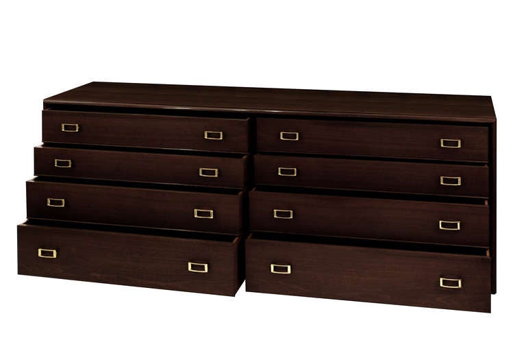 Long chest of drawers in dark walnut with brass buckle pulls and sabots by Paul Frankl for Johnson Furniture, American, 1950s (branded in drawer “Johnson Furniture”) (newly refinished by Lobel Modern).