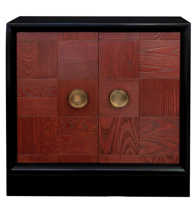 Liquor cabinet in ebonized mahogany with oak paneled front and brass hardware, interior space beautifully outfitted, by James Mont, American 1950's (refinished by Lobel Modern)