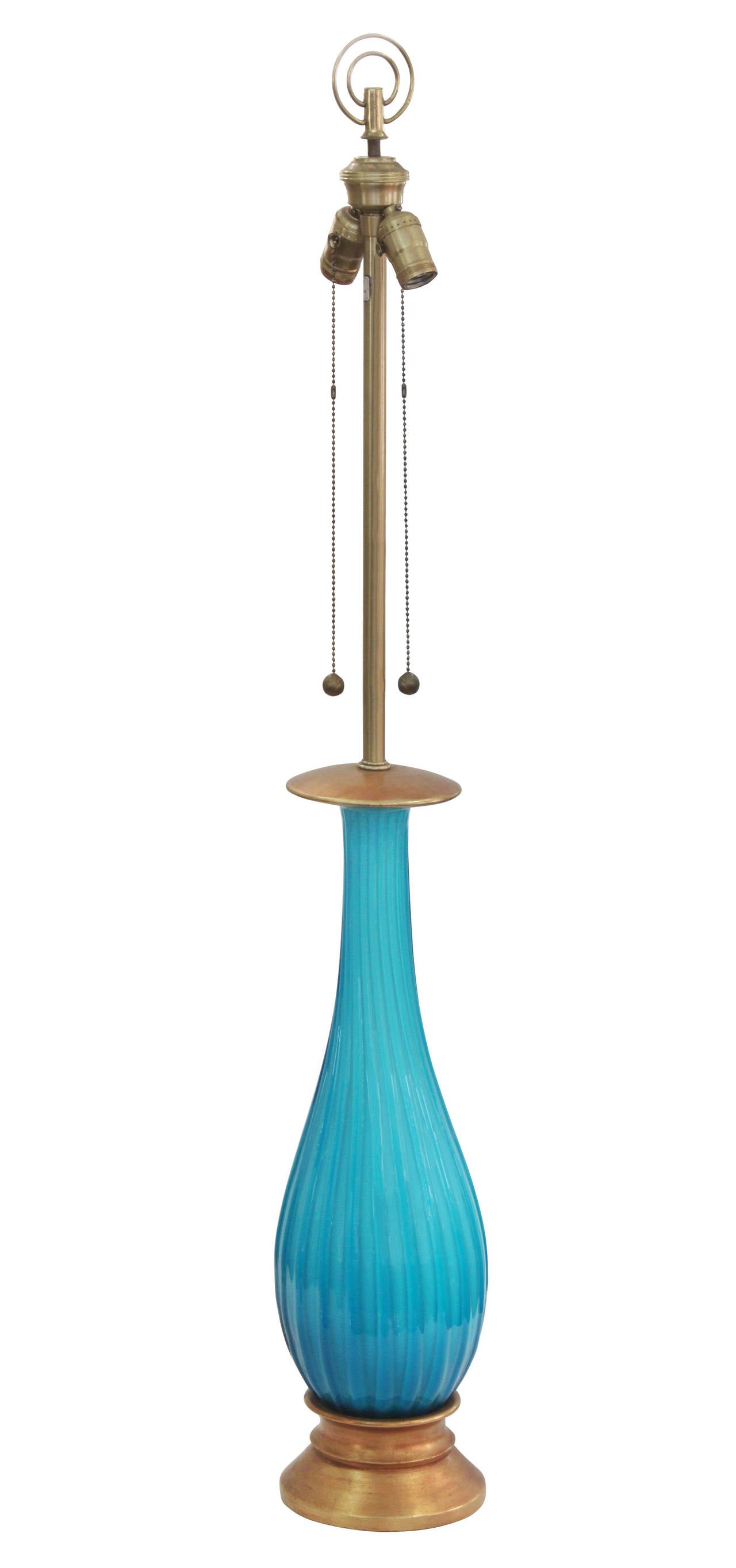 Large handblown table lamp in channeled aqua glass with gilded base by Seguso (Murano, Italy) for Marbro Lighting, American, 1950s.
“Marbro Original” label located on neck. 
The lampshade shown in photo is 16 inches in diameter.