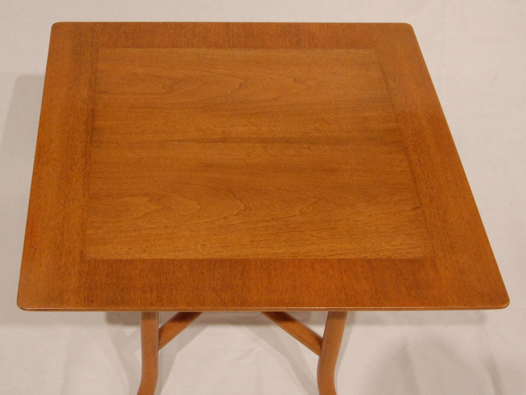 Side table No. 3335 in walnut with double stretcher design by T.H. Robsjohn-Gibbings for Widdicomb, American 1950's.  This is a very elegant design.