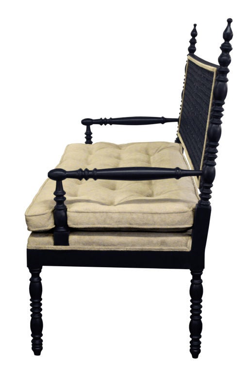 Hollywood Regency style bench with hand-turned elements and caned back, American 1970's.  <br />
This bench is lacquered dark blue.