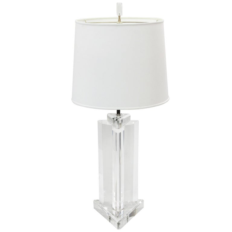 Pair of trisymmetric lucite table lamps by Les Prismatiques, American 1970's. This pair of lucite lamps is very chic.