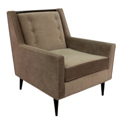 Elegant Lounge Chair with Wood Trim at Top