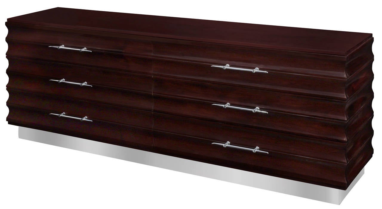 Large and exceptional chest of drawers in dark walnut, scalloped design with beautifully crafted chrome pulls by Tommi Parzinger for Parzinger Originals, American, 1960s. (Signed “Parzinger Originals” inside drawer).