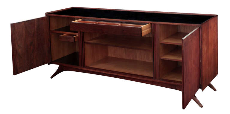 Credenza in walnut with tambour doors, sculptural legs, and black laminate top by Vladimir Kagan, American 1950's