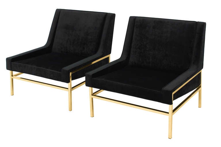 Pair of slipper chairs with architectural polished brass bases by Harvey Probber, American 1950's. Reupholstered in black velvet by Lobel Modern.  The brass has been polished and lacquered so it will not tarnish.