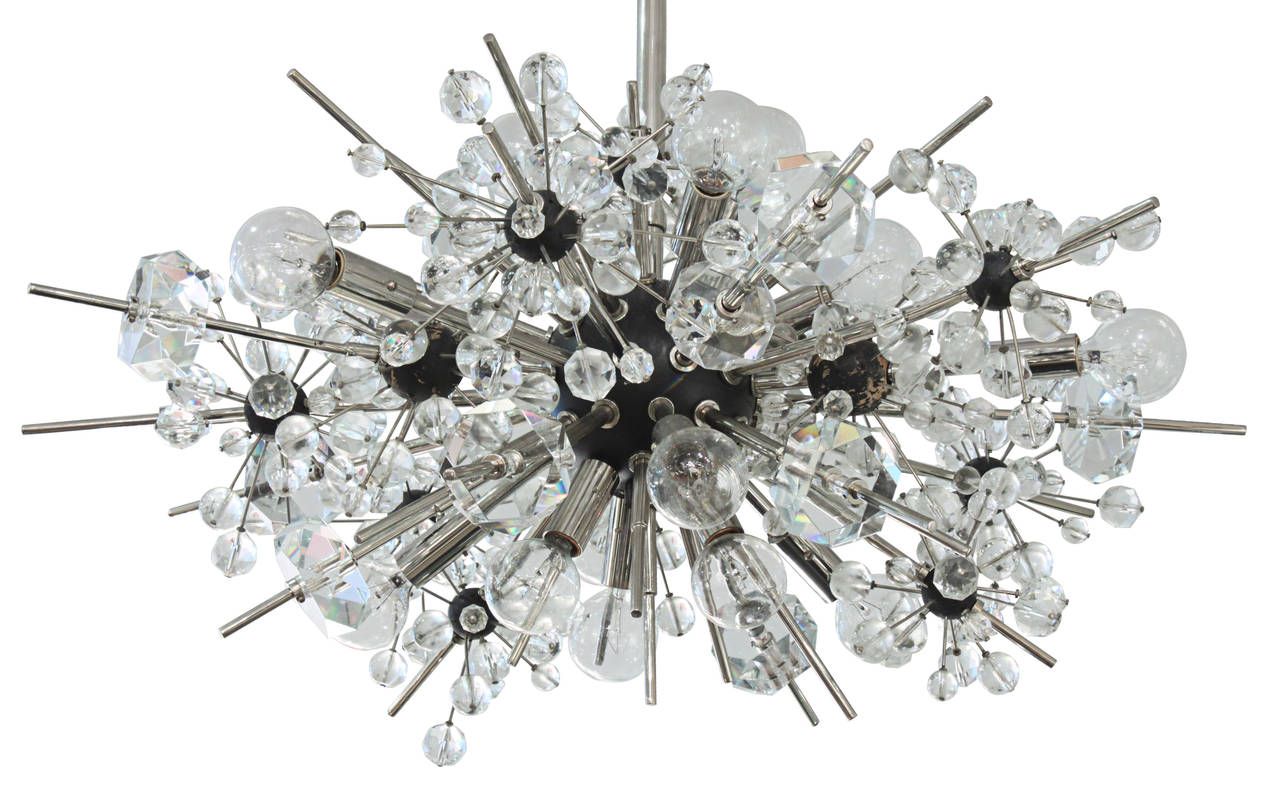 Starburst chandelier in stainless steel with crystal spheres by Lobmeyr, 
Austrian, 1960s. Lobmeyr was the company that supplied the extraordinary lighting at The Metropolitan Opera House in NYC.

43 inches to top of canopy.