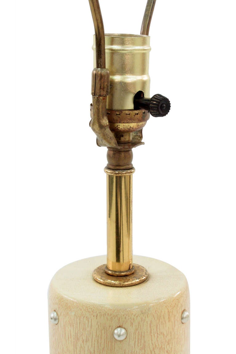 Pair of studded mahogany table lamps on brass bases by Tommi Parzinger for Rembrandt Lighting, American 1950’s
