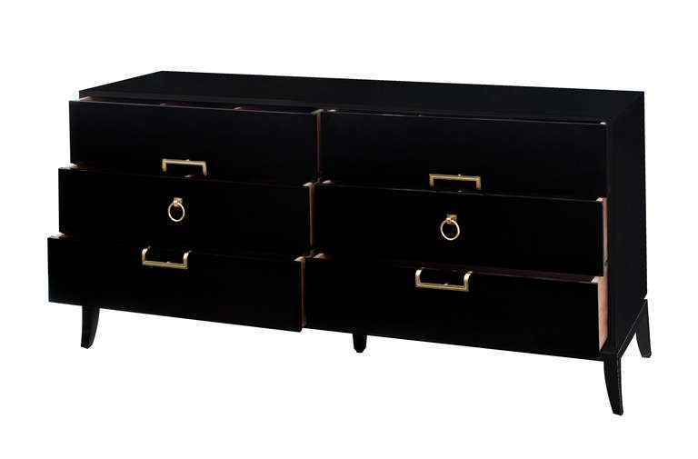 Chest of drawers in dark ash with iconic brass hardware and tapering legs by Tommi Parzinger for Parzinger Originals, American 1960's (branded 