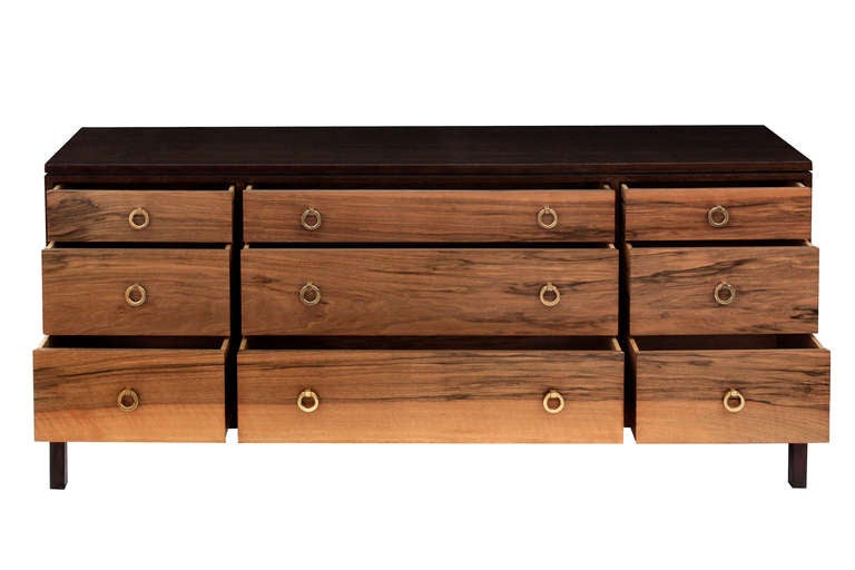 Long chest model No. 6423 with drawer fronts in French walnut with brass ring pulls by Edward Wormley for Dunbar, American 1964 (Original metal tag in drawer).  This chest is rare and beautifully crafted.