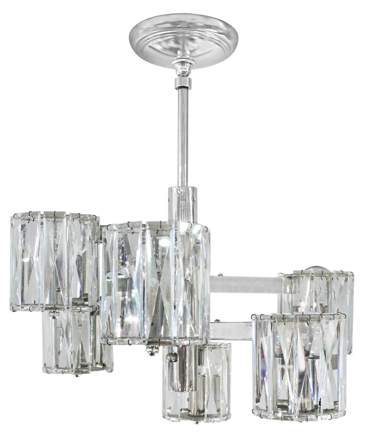 Chic chandelier in polished chrome, six arms with cut crystals, by Lobmeyr, Austria, 1950's (stamped in metal). Lobmeyr was the company that supplied the extraordinary lighting at The Metropolitan Opera House in NYC.

19 inches to top of canopy.
