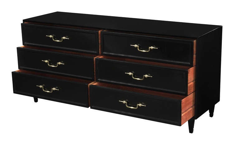 Chest of drawers in ebonized teak with decorative brass hardware by Grosfeld House, American, 1940s (label in drawer reads 