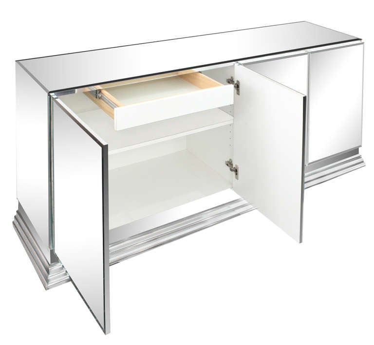 Elegant four-door credenza, mirrored with a stepped steel base by Ello, American, 1970s.