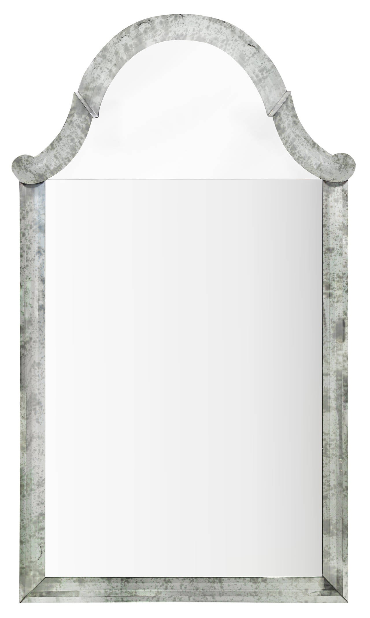 Pair of monumental and exceptional mirrors with antiqued silvered frames, American, 1940's. Each glass piece around the mirror is hand-finished and beveled.