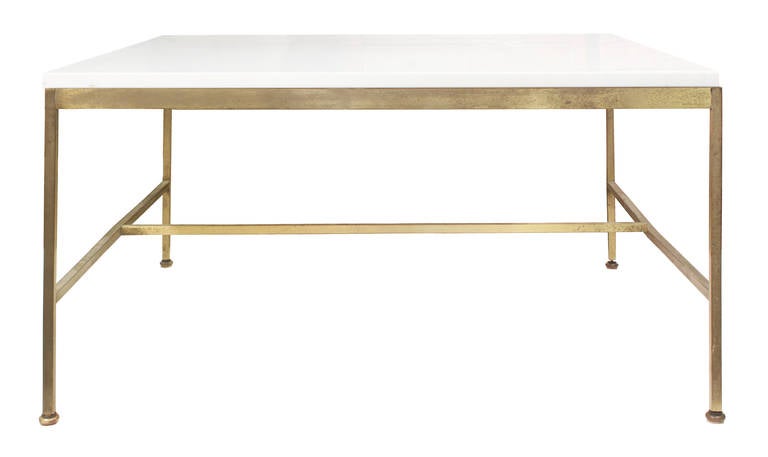 Square table No. 1093, top in white carrera glass with architectural aged brass base by Paul McCobb, The Irwin Collection, American, 1950s. The glass is in excellent condition; the base is patinated and aged.