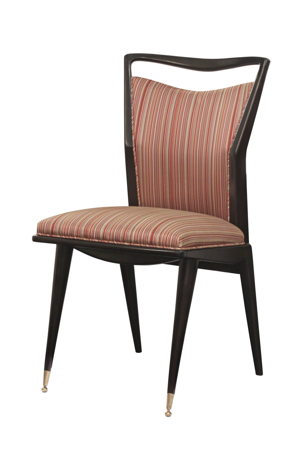 Set of six sculptural dining chairs, ebonized with elegant brass sabots on front legs, Italian, 1950s.