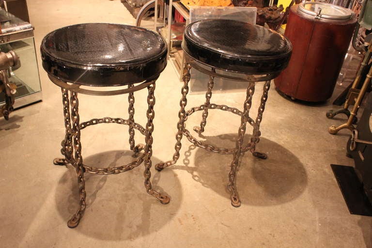 These are a great chunky pair of 1960's stools made of welded chain. The construction is super and the tops are the original black patent leather .
