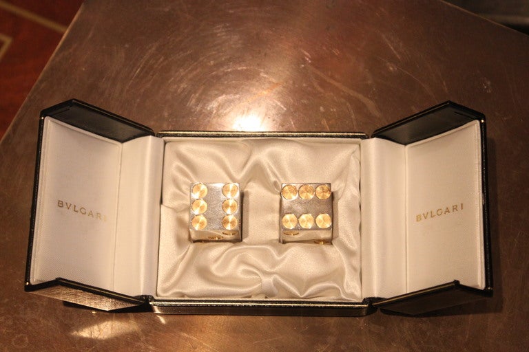 New Old stock sterling and gold Bvlgari dice marked Bvlgari Las Vegas. Never been out of their original box. We love these.