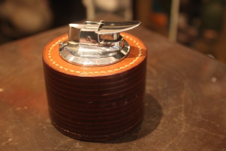 Beautiful tan stacked leather lighter designed by Dupre Lafon