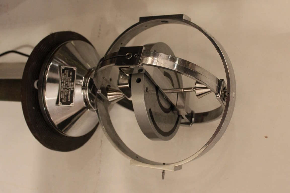 This is a wonderful polished aluminum giant motorized Gyroscope. The pedigree of this machine is quite impressive. It was developed by M.I.T.  and produced by A.C. spark plugs  under the electronics division of General Motors. The Mitac Gyro is no