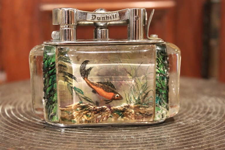 These Dunhill's are perhaps the most coveted of  collectable lighters. The Aquariums are all reversed carved and painted making no two alike. Since their introduction  in the 1950's, these Aquariums have been a must have for lighter users and