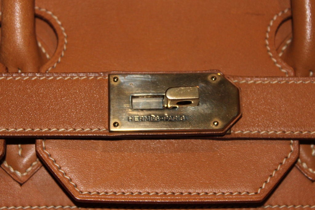 Beautiful and mint, the leather on this bag is perfect. It's soft and worn, but in impeccable condition. <br />
Original lock and key included.