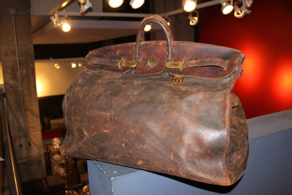 This bag is huge, and has a beautiful patina on the leather. It's a dream bag. 55 cm