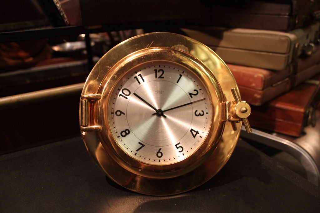 Rare brass Hermes Porthole clock. The movement is battery operated.