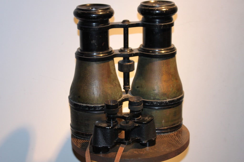 These incredible binoculars are out of this world. They are made exactly like the hand held size that we have seen hundred of. These are a staggering one foot high!They were used as a window display for an optical shop in Paris
