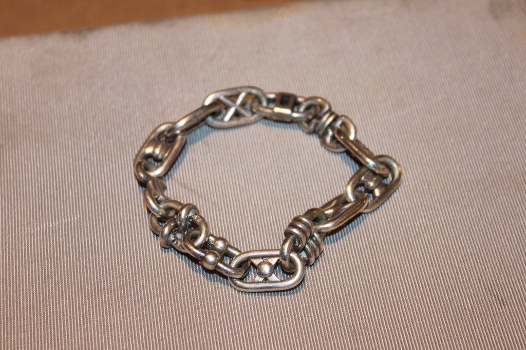 Dating from the 50s or 60s, this incredible Hermes sterling bracelet was fabricated with a link that Hermes no longer produces. It is authentic and bears both the Hermes signature on the clasp but also all of the appropriate French silver touch