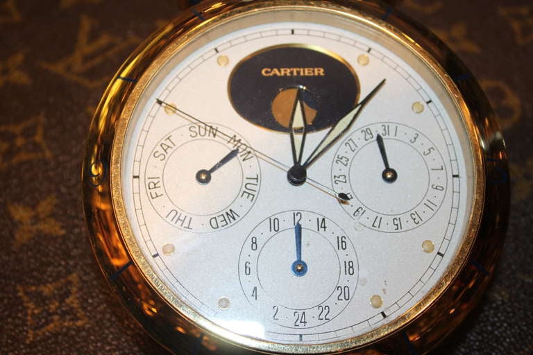 Cartier moon phase calendar clock in the style of a Pasha watch. It is battery operated .