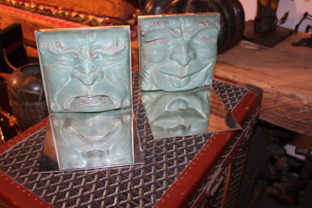 These are a fantastic set of Piwabic glazed Terra-cotta tiles.Piwabic was an American tile manufacturer that was founded in 1903. These tiles were created around 1915 and were later retro-fitted as bookends in the middle of the 20th century. The