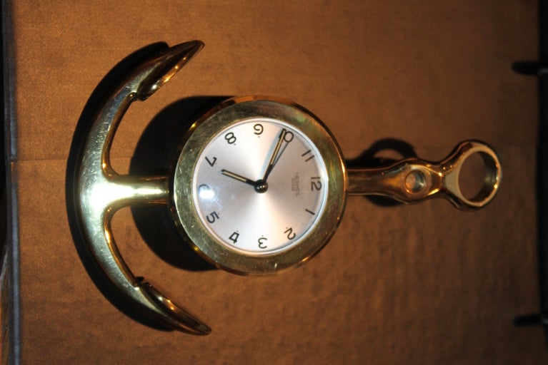 Hermes Brass anchor clock has an 8 day movement . It can be hung or sit on a desk