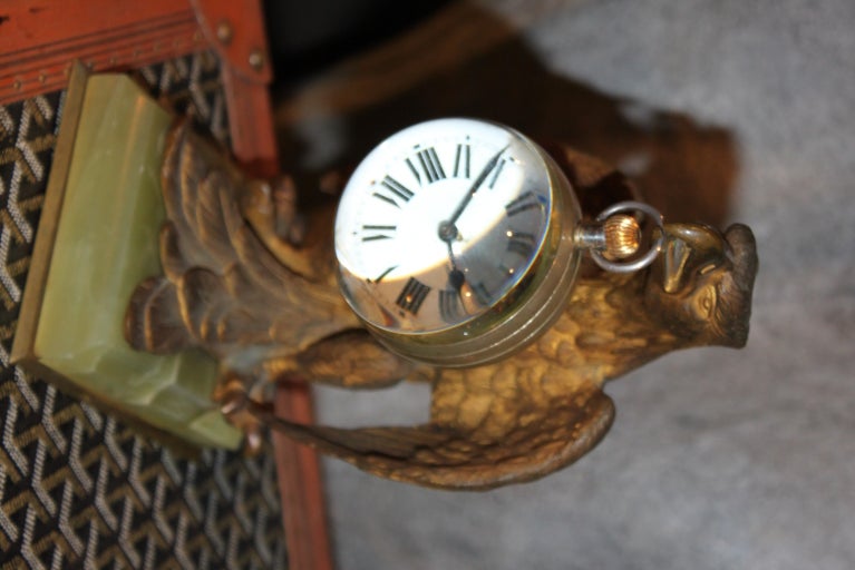 We sell many of these Ball clock or paperweight clocks as they are sometimes referred to. This on comes on a magnificent bronze holder representing an Eagle .The clock which has an 8 day movement that works perfectly,