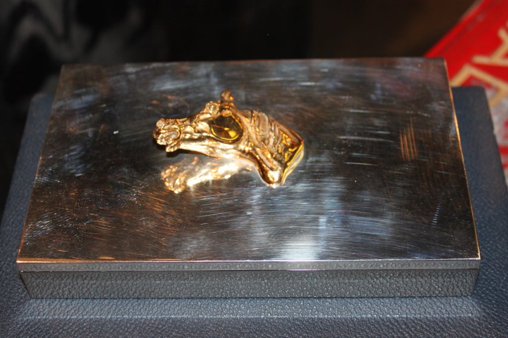 Hermes horse head box with gold head is quite unusual to find. The box is perfect for anything as the dividers are removable. The box shows a reflection but is in great condition.
