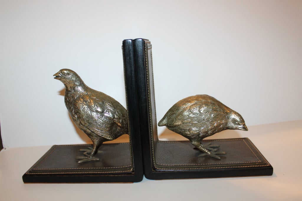 Rare Gucci bird bookends. The silvered bronze bookends are mounted on stitched pig skin leather. super quality