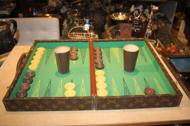 This Rare traveling Vuitton Backgammon Set was a custom order. It has all the original Pieces. The case is made super well like a Vuitton trunk.